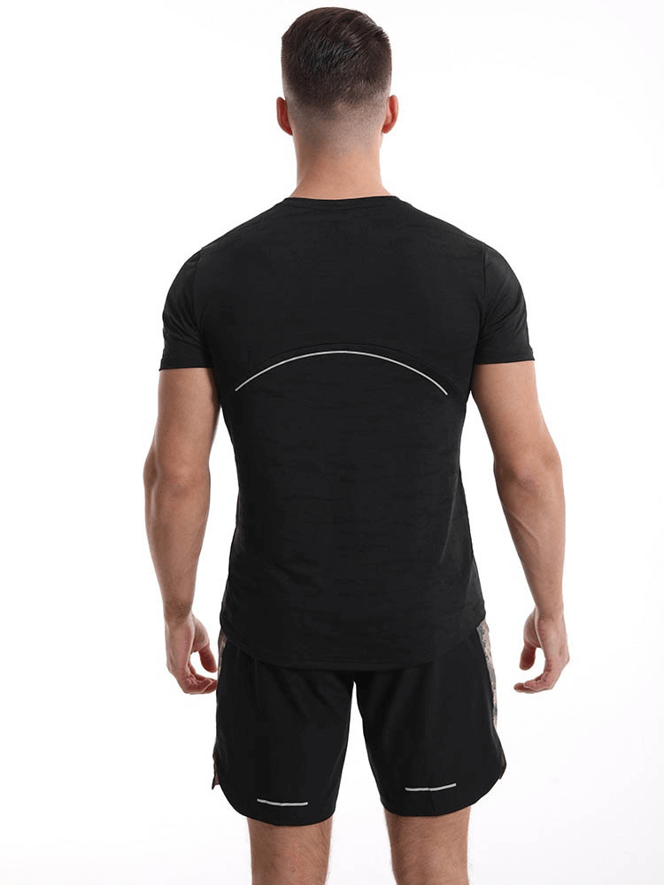 Back view of a man wearing a black casual short sleeves basketball T-shirt, highlighting its elastic fit for sports and exercise.